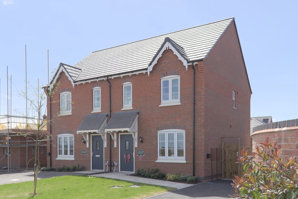 A red brick new-build semi-detached pair of houses in Broadnook, Leicestershire